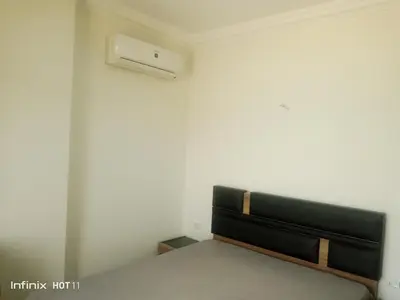 a bedroom with a bed and a air conditioner at Casablanca resort hi in Hurghada