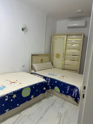 two beds in a small room withthritisthritisthritisthritisthritisthritisthritisthritisthritis at Red Sea view in Hurghada