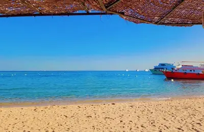 two boats in the water on a beach at AL Andalusia Hurghada in Hurghada