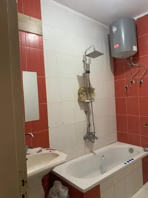 a bathroom with a tub and a toilet and a sink at Luxor is adorable! in Luxor
