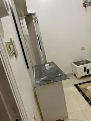 a kitchen with a sink and a refrigerator at Luxor is adorable! in Luxor