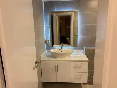 a bathroom with a sink and a mirror at Duplex in Edelma Oldtown Sahl Hasheesh in Hurghada