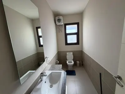 a bathroom with a sink and a toilet at Cyan Elegant 3BR Golf View Escape in Hurghada