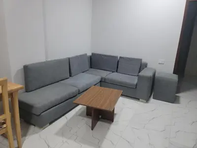 a living room with a couch and a coffee table at st george in Hurghada