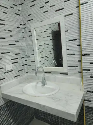a bathroom with a sink and a mirror at st george in Hurghada