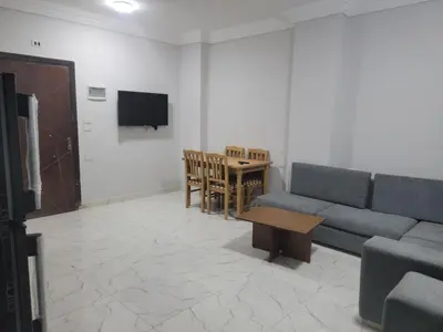 a living room with a couch and a table at st george in Hurghada