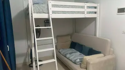 a living room with a bunk bed and a couch at Paradise at Tiba Al Ahyaa, Hurghada in Hurghada