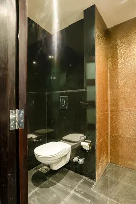 a bathroom with a toilet and a sink at Private Ali Pasha 2BR Pool Access + Dining Perks in Hurghada