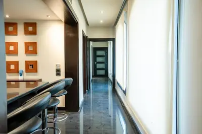 a corridor of a hospital with stools at Private Ali Pasha 2BR Pool Access + Dining Perks in Hurghada