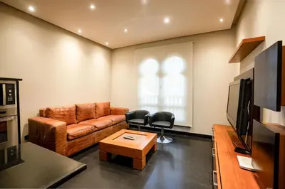 a living room with a couch and two chairs at Private Ali Pasha 2BR Pool Access + Dining Perks in Hurghada
