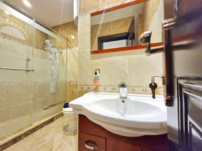 a bathroom with a sink and a shower and a toilet at Gravity Sahl Hasheesh Not Egyptians in Hurghada