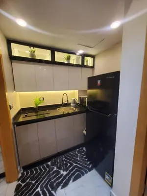 a kitchen with a sink and two windows at Mirage bay aquapark 772B in Hurghada
