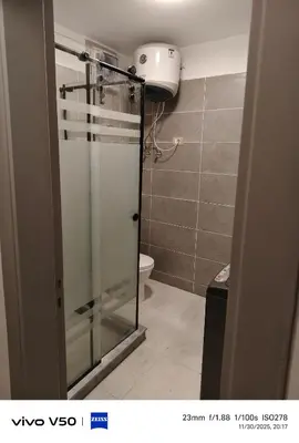 a bathroom with a glass shower with a toilet at Sahl hashish in Hurghada