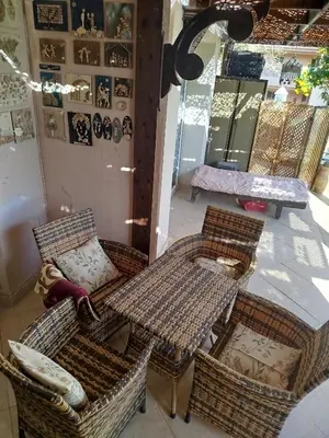 a room with wicker chairs and tables in a store at Apartment with garden in sahl hasheesh in Hurghada