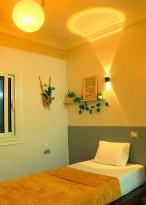 a bedroom with a bed in a room at Jme Bunks Hostel in Aswān