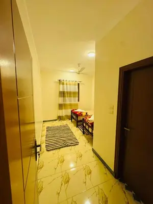 a living room with a room with a door and a room with a room at MERIT Guest House in Aswan
