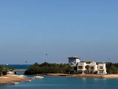 a group of houses and boats in the water at The Charming Beach Front Villa At Fanadir Bay W Private Pool in Hurghada