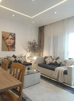 a living room with a couch and a table at Hurghada luxury apartment sea view in Hurghada