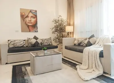a living room with a couch and a coffee table at Hurghada luxury apartment sea view in Hurghada