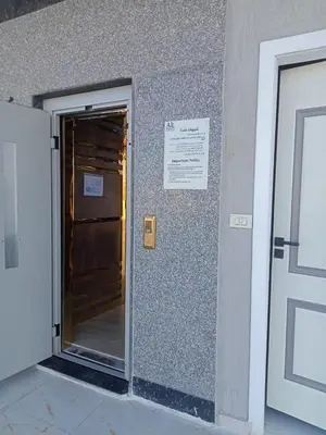 an entrance to a building with a door and a sign at Hurghada luxury apartment sea view in Hurghada