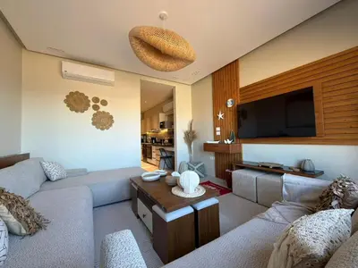 a living room with a couch and a flat screen tv at Spacious Gouna Studio | Pool Access + Terrace in Hurghada
