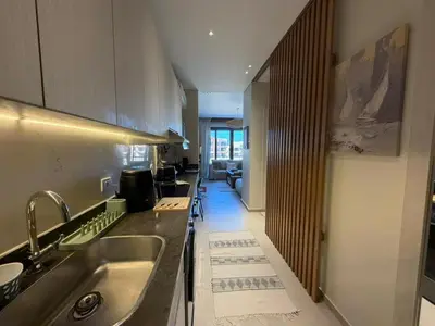 a kitchen with a sink and a counter top at Spacious Gouna Studio | Pool Access + Terrace in Hurghada