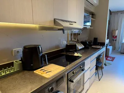 a kitchen with a sink and a counter top at Spacious Gouna Studio | Pool Access + Terrace in Hurghada