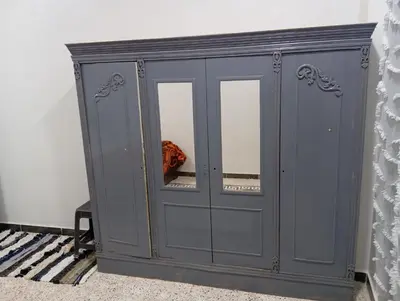 a gray cabinet with two mirrors in a room at Rafe Guest House in Luxor