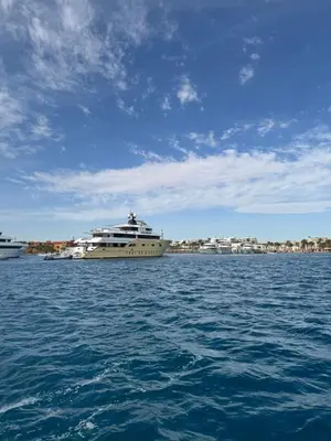 a large boat in the water with buildings in the background at Jo travels in Hurghada