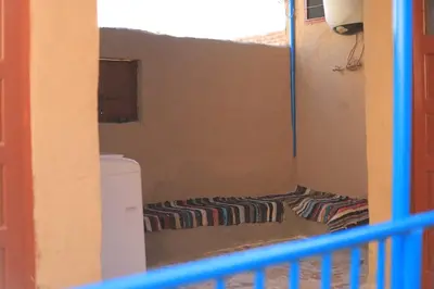a small room with a toilet in a room at Moonlight in Al Aqālitah