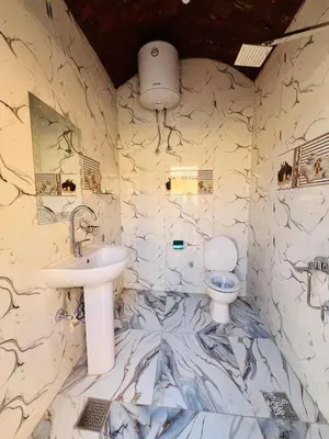 a bathroom with a sink and a toilet at Horus Golden Luxor in Luxor