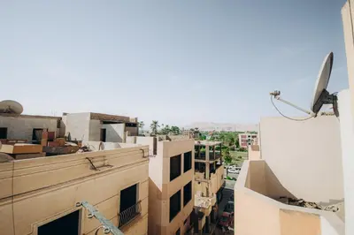 an aerial view of a city with buildings at The Golden House on the Avenue of Sphinxes in Luxor