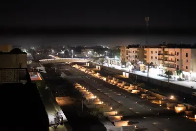 a view of a city at night with lights at The Golden House on the Avenue of Sphinxes in Luxor