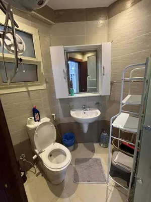 a bathroom with a toilet and a sink at Sunrise Luxury Apartment in Hurghada