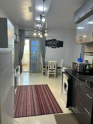 a kitchen with a rug on the floor of a kitchen at Sunrise Luxury Apartment in Hurghada