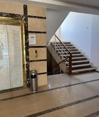 a staircase in a building with a trash can at Studio Mirage Bay in Hurghada