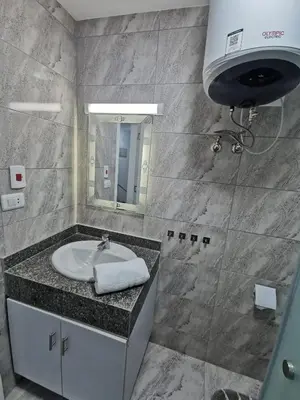 a bathroom with a sink and a mirror at Selena Bay Resort - VIP apartment with Private Beach Area in Hurghada