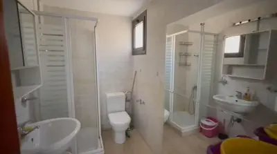 a bathroom with a toilet and a sink and a shower at Sea View luxury chalet in Hurghada