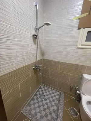 a bathroom with a shower with a toilet at Tartils Beach Resort Al-Ahyaa in Hurghada