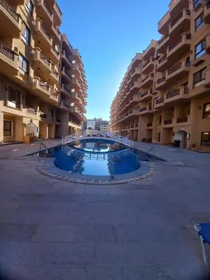 an empty courtyard in a large apartment building at Tartils Beach Resort Al-Ahyaa in Hurghada