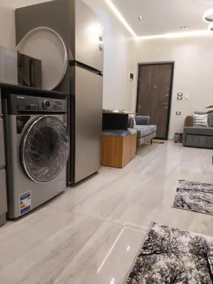 a living room with a washer and dryer at Solitaire in Hurghada
