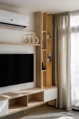 a living room with a flat screen tv and a window at The Best House in Makadi in Hurghada