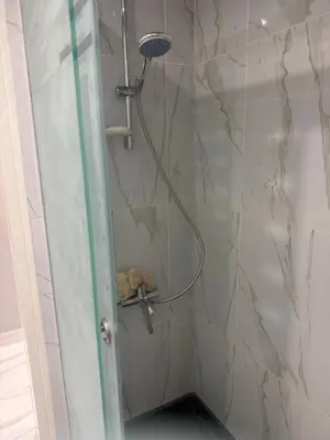 a shower with a shower head in a bathroom at Veranda resort in Hurghada