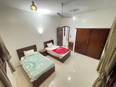 a room with two beds in a room at Durrat al-Nahr in Luxor