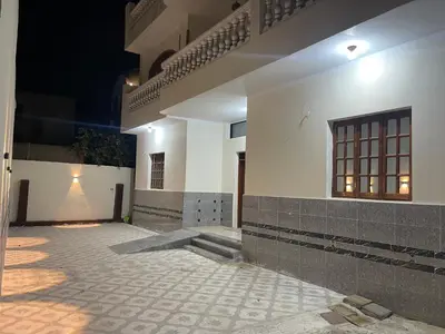 an empty courtyard of a building at night at Durrat al-Nahr in Luxor
