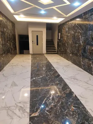 an empty lobby with a marble floor and stairs at سولتير in Hurghada