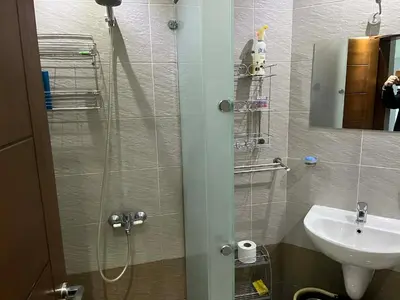 a small bathroom with a shower and a sink at rezort Al Hambra, rezort Princess in Hurghada