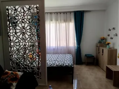 a room with a bed and a window at Sheraton Plaza 319 in Hurghada