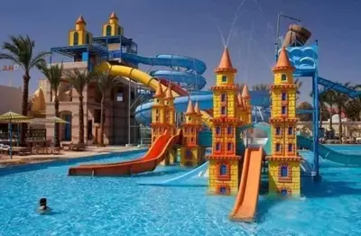 a water park with a water slide in the water at Mirage Bay Resort Aquapark Cap Ahmed Suite in Hurghada