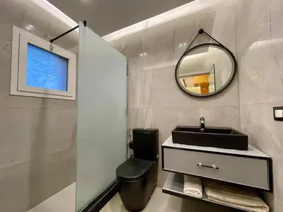 a bathroom with a sink and a mirror at مارينا الغردقه in Hurghada